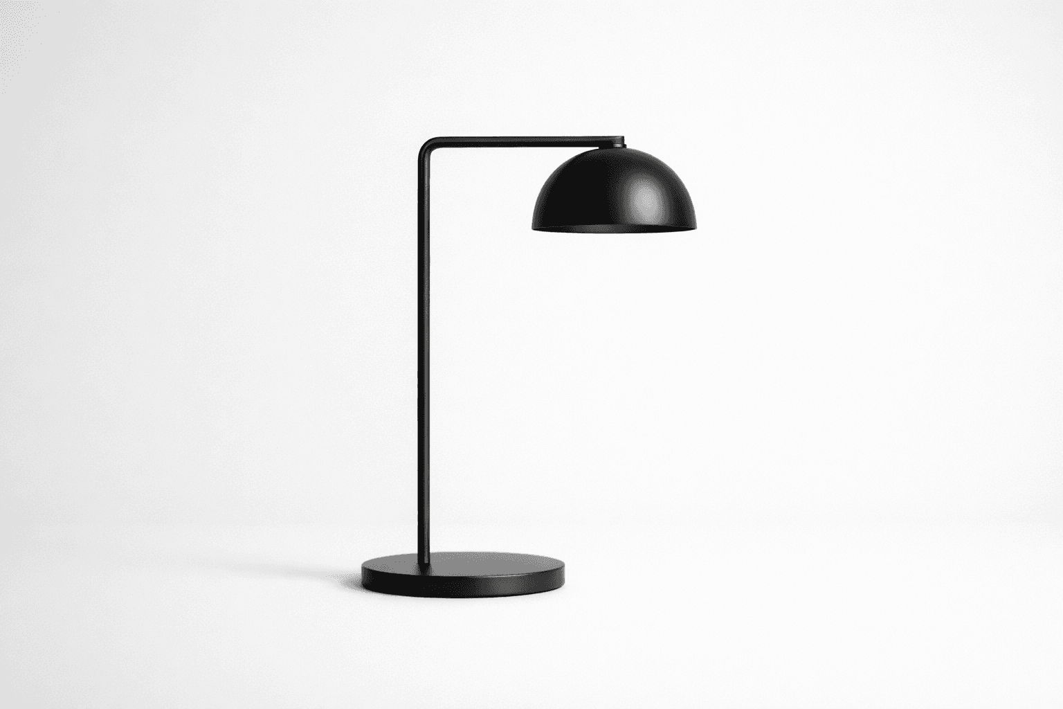 Black and white product photograph of an offset table lamp